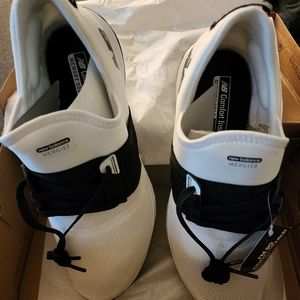 NIB womens size 9.5 New Balance white and black sneakers.